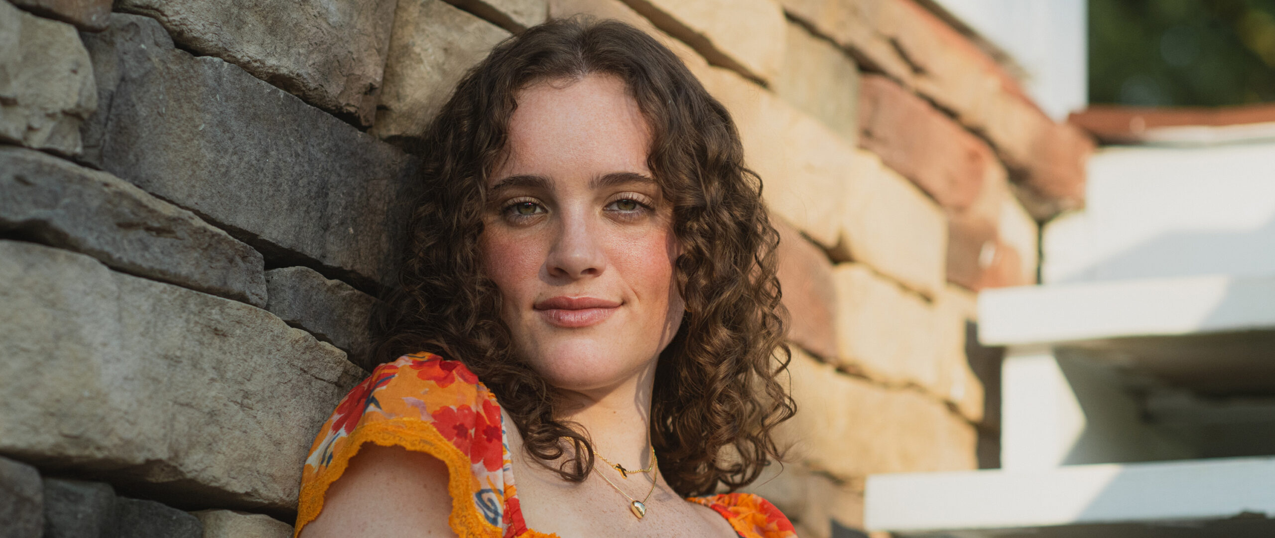 a high school senior poses during a photo shoot