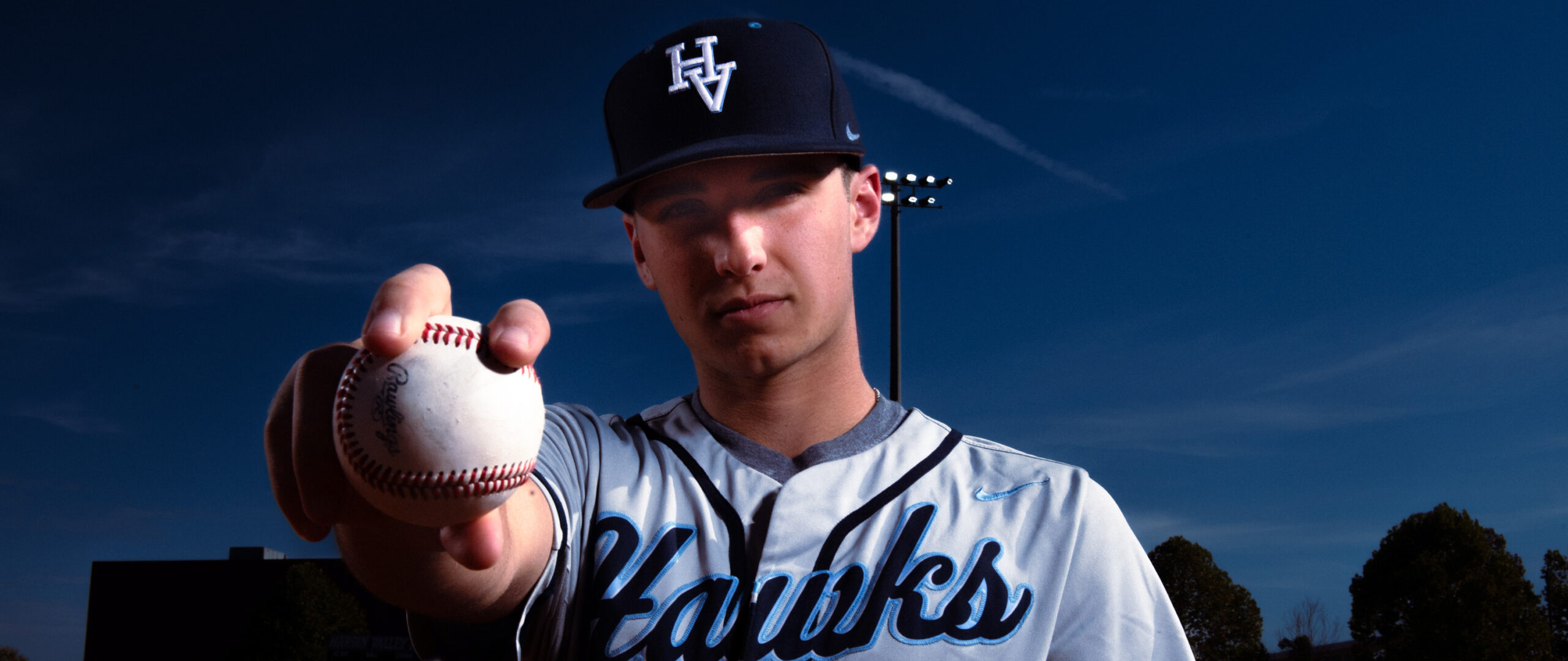 a high school baseball player during a sports photo shoot in knoxville