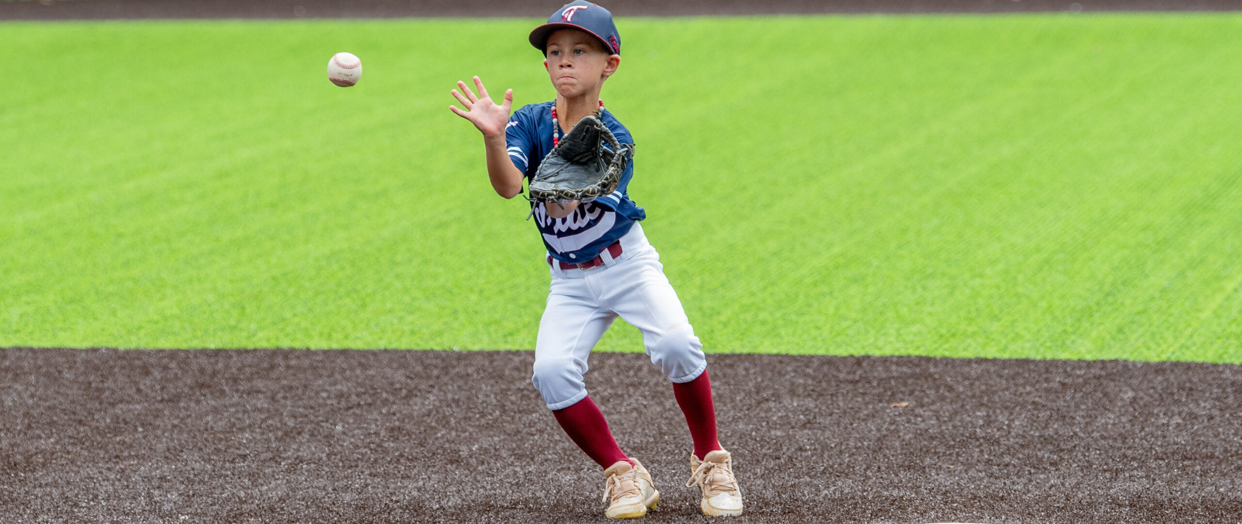 a youth baseball player fields a throw in knoxville