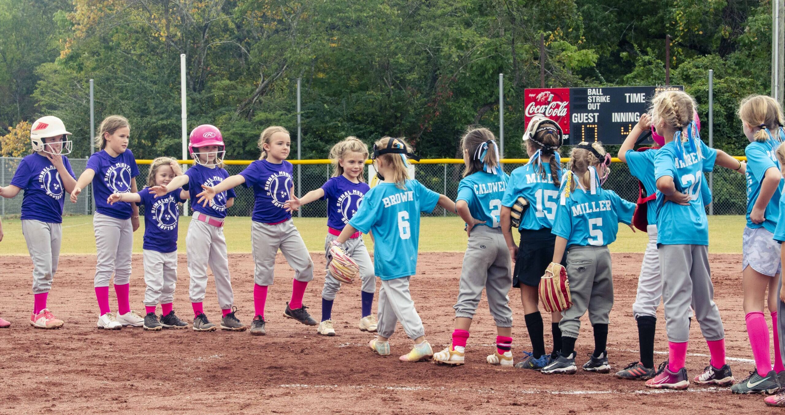 a youth sports team congratulates their opponent after a game in Signal Mountain