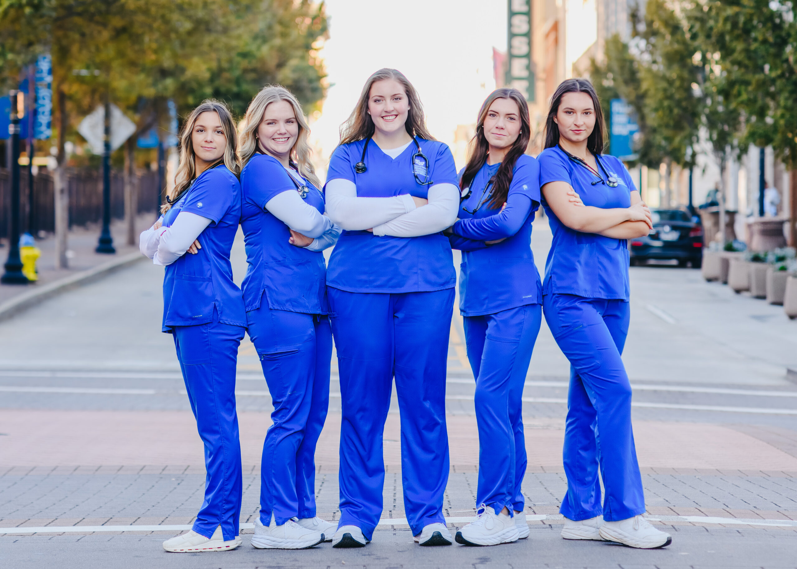 a group of nursing students pose for graduation photos in Knoxville