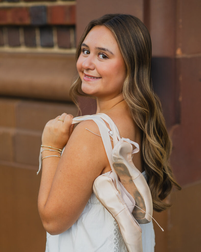 a high school senior poses for story-driven senior photo