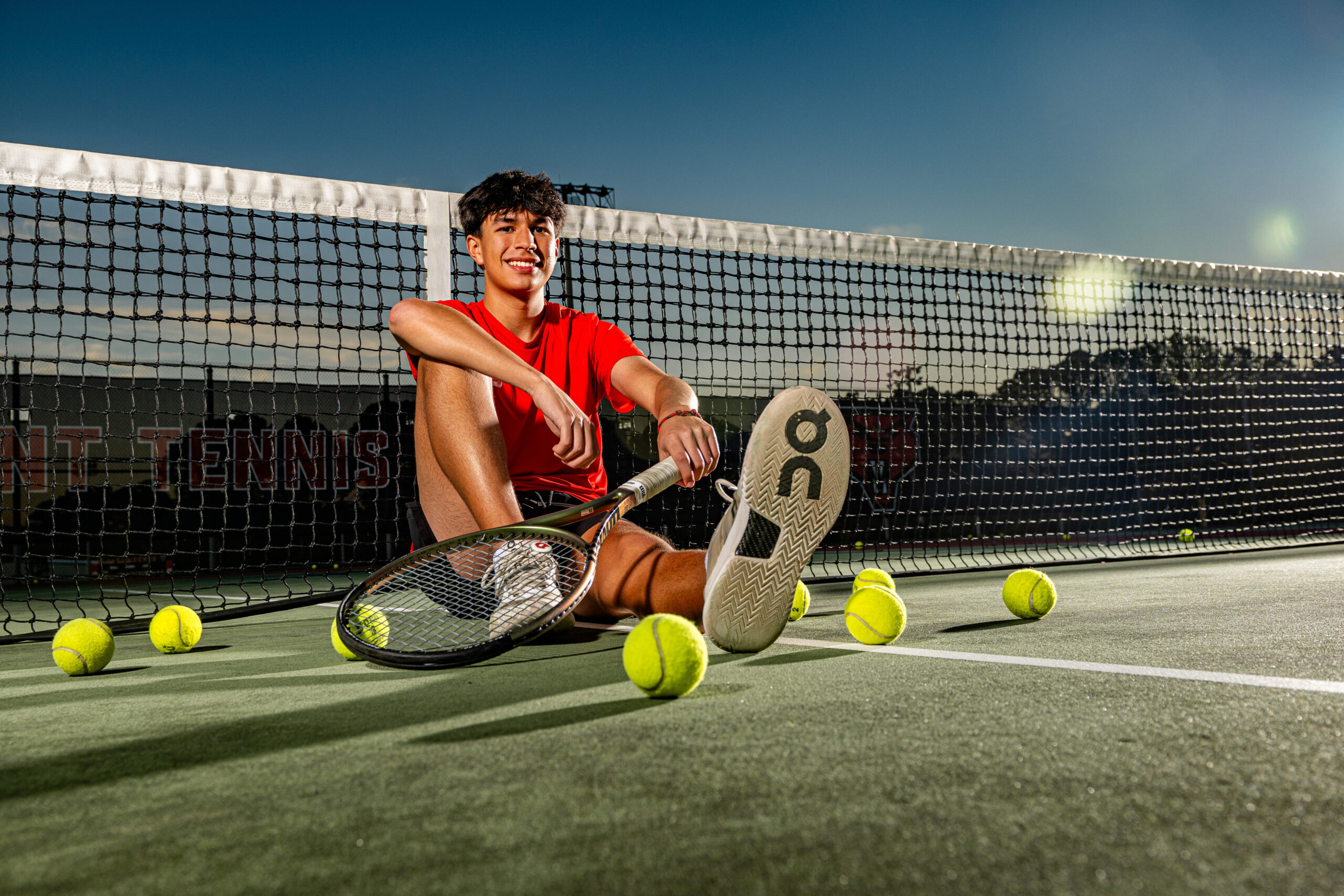 a dalton high school tennis player taking his senior photos in dalton georgia