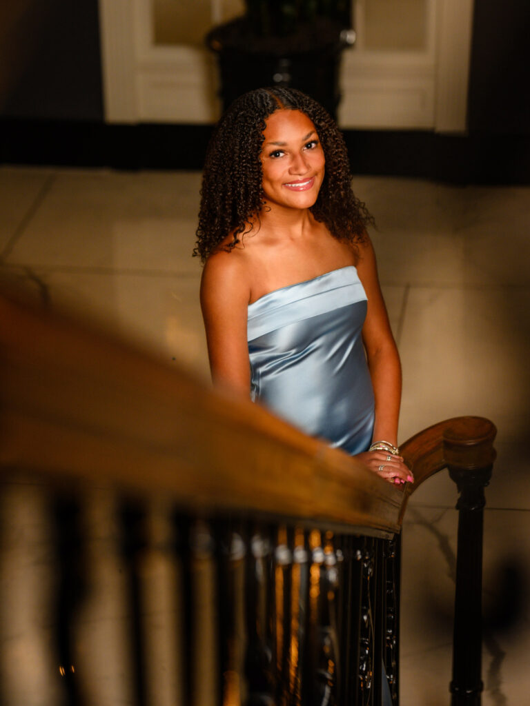 Read House Chattanooga senior portraits — high school senior in silver-blue satin gown on historic grand staircase